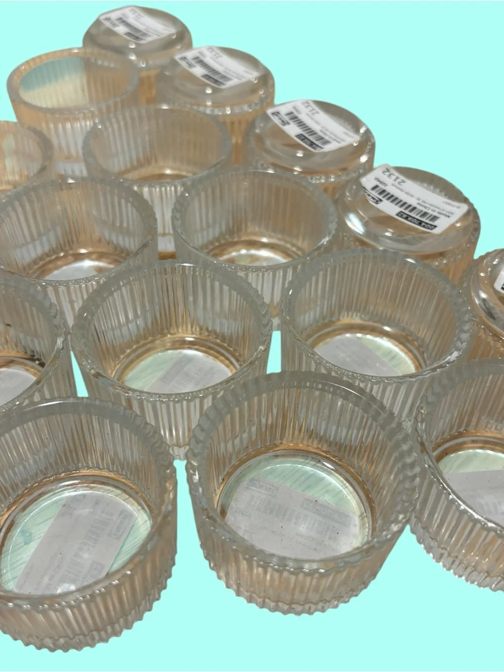21 IKEA FINSMAK clear glass tealight holders.